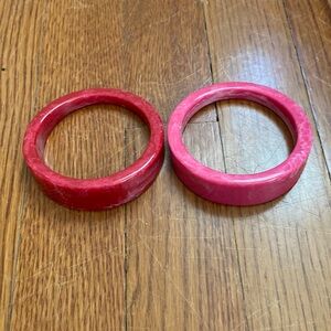 Two pink and red bangles